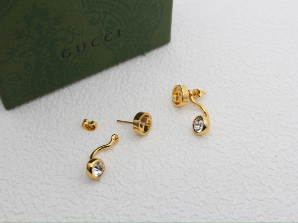 G*u*i earrings